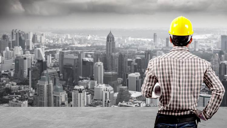 A engineer over looking a city landscape